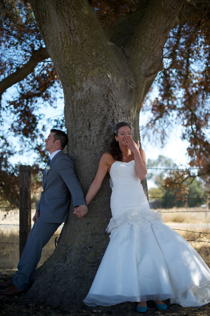 Newlyweds in front of a tree