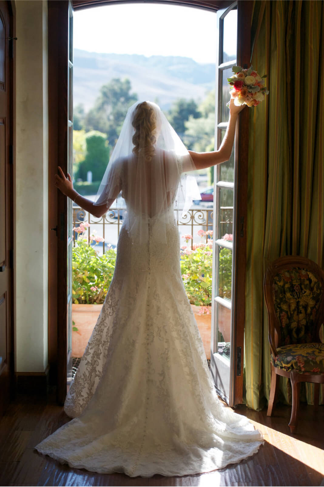 Bride is photographed from behind on her big day